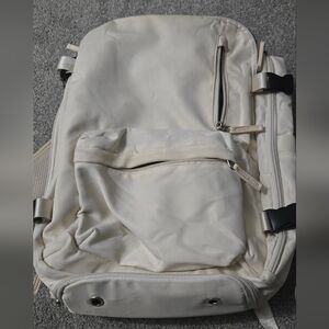 Travel backpack with shoe pouch